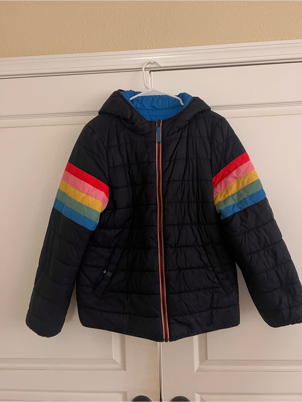 Women’s reversible Blue Puffer Jacket with Rainbow Sleeve Stripes